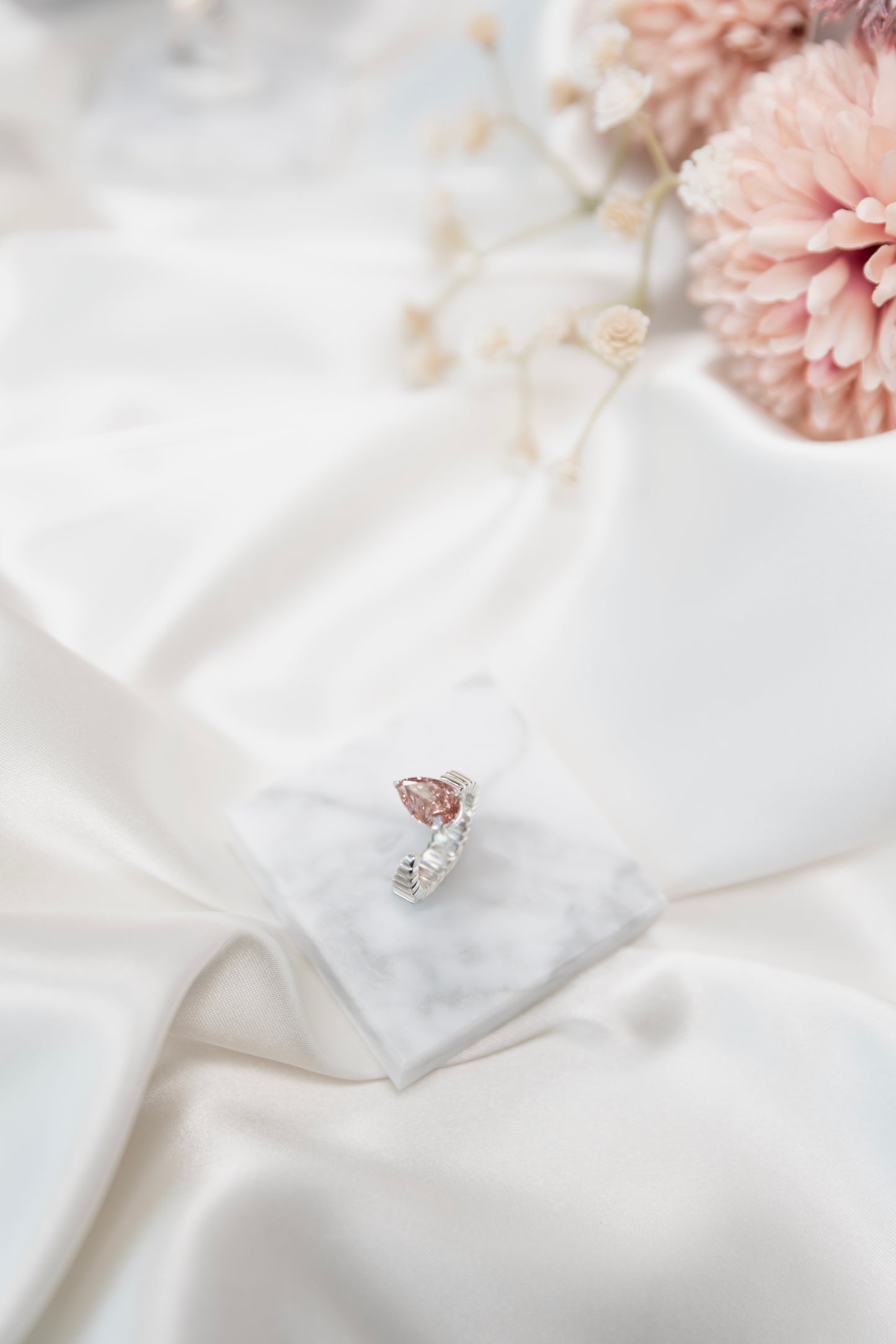 Fluted open band ring with pear diamond